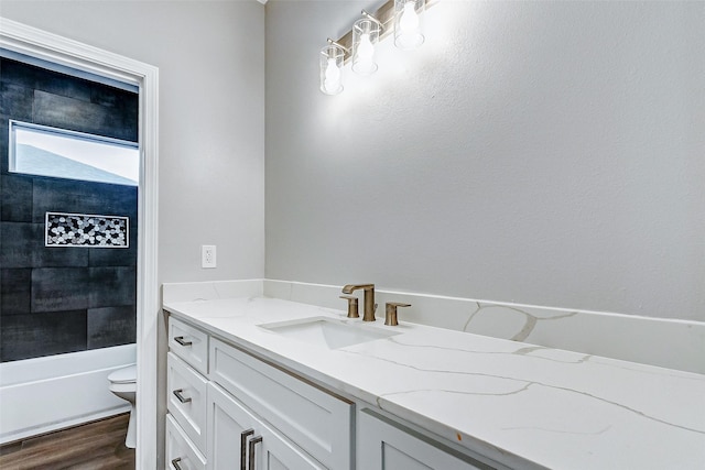 1743 Blue Water Hwy, Surfside Beach, TX 77541 - bathroom featuring vanity, wood finished floors, and washtub / shower combination