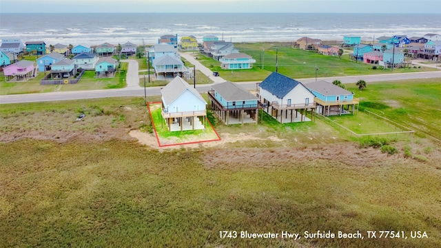1743 Blue Water Hwy, Surfside Beach, TX 77541 - aerial view of residential area featuring a large body of water and property boundaries highlighted
