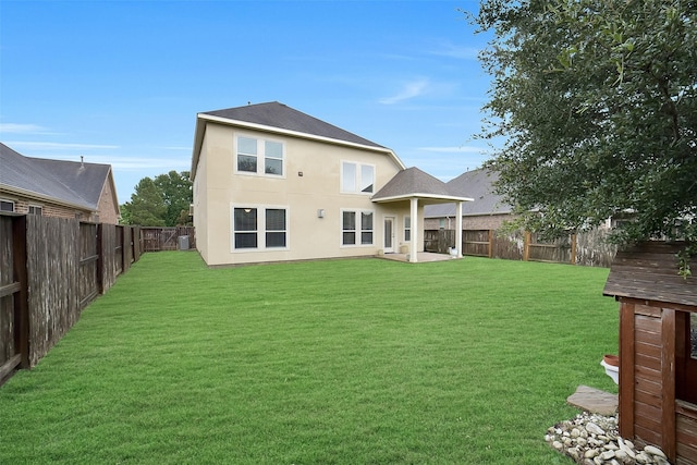 6222 Deer Run Xing, Katy, TX 77493 - back of house with a fenced backyard and stucco siding
