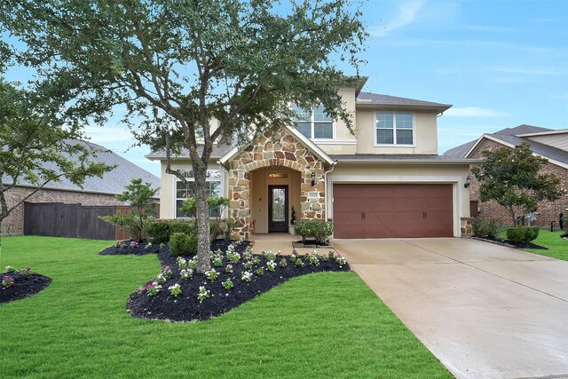 6222 Deer Run Xing, Katy, TX 77493 - view of front of home featuring stone siding, concrete driveway, stucco siding, and a garage