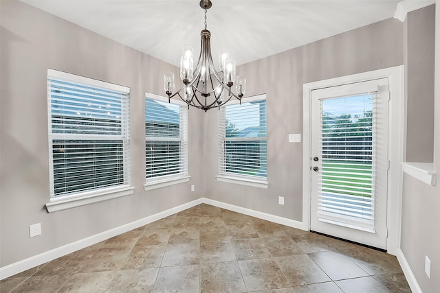 6222 Deer Run Xing, Katy, TX 77493 - unfurnished dining area with a chandelier and baseboards