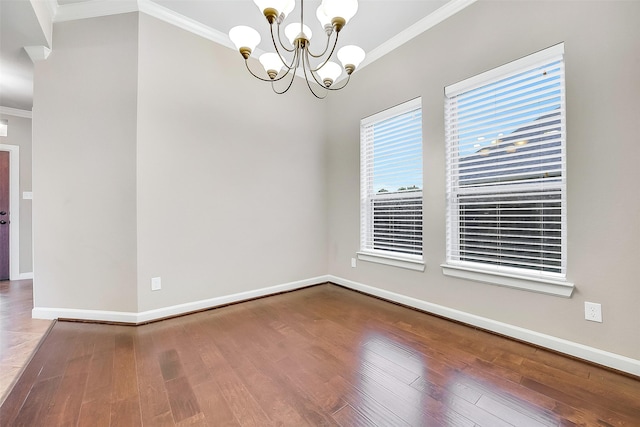 6222 Deer Run Xing, Katy, TX 77493 - spare room with ornamental molding, a chandelier, and wood finished floors