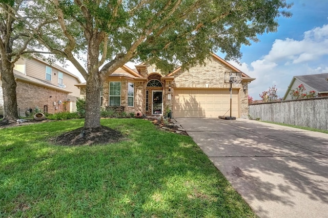 21714 Venture Park Dr, Richmond, TX 77406 - view of front of property with a garage, concrete driveway, and stone siding