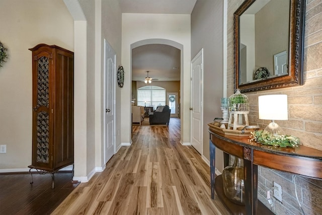 21714 Venture Park Dr, Richmond, TX 77406 - hall with arched walkways and light wood-type flooring