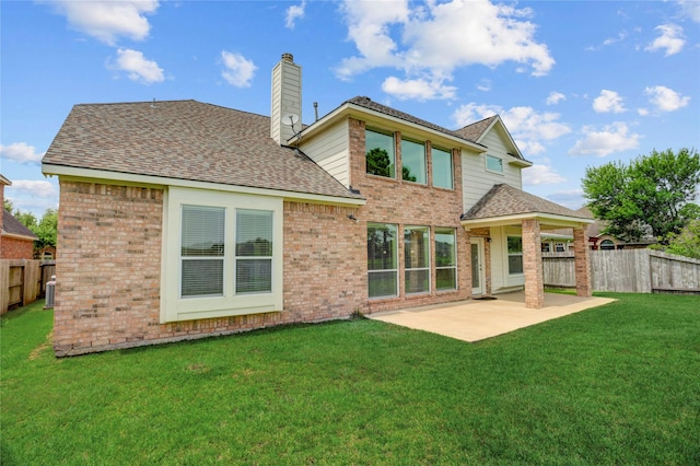 13508 Sweet Wind Ct, Pearland, TX 77584 - rear view of house with a patio, brick siding, a chimney, and roof with shingles