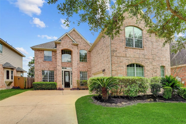 13508 Sweet Wind Ct, Pearland, TX 77584 - traditional-style house with brick siding, a garage, and driveway