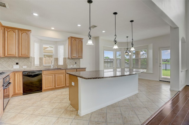 13508 Sweet Wind Ct, Pearland, TX 77584 - kitchen featuring black dishwasher, backsplash, healthy amount of natural light, oven, and recessed lighting