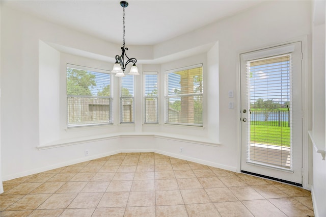 13508 Sweet Wind Ct, Pearland, TX 77584 - unfurnished dining area featuring plenty of natural light, a chandelier, and light tile patterned flooring