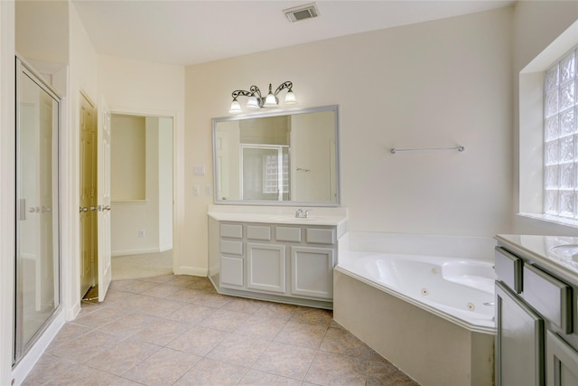 13508 Sweet Wind Ct, Pearland, TX 77584 - full bathroom featuring a shower stall, vanity, a jetted tub, and tile patterned flooring