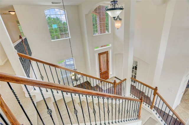 13508 Sweet Wind Ct, Pearland, TX 77584 - stairway with a towering ceiling and arched walkways