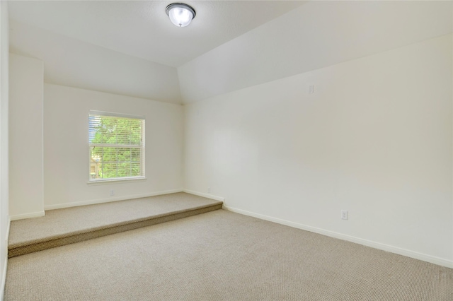 13508 Sweet Wind Ct, Pearland, TX 77584 - spare room featuring carpet floors and vaulted ceiling