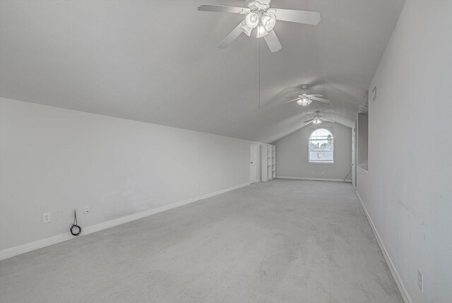 8014 Pine Wood Ct, Baytown, TX 77523 - additional living space with lofted ceiling, a ceiling fan, and light carpet