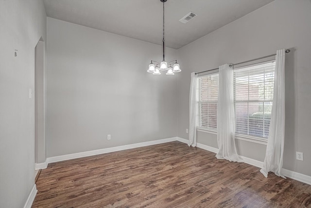8014 Pine Wood Ct, Baytown, TX 77523 - unfurnished room with wood finished floors and a chandelier