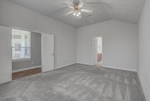 8014 Pine Wood Ct, Baytown, TX 77523 - unfurnished bedroom with carpet floors, lofted ceiling, a ceiling fan, and ensuite bath