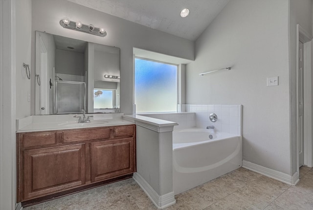 8014 Pine Wood Ct, Baytown, TX 77523 - bathroom with vanity, a garden tub, and a shower stall