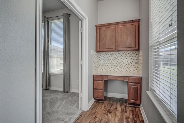 8014 Pine Wood Ct, Baytown, TX 77523 - hallway featuring a desk and dark wood-style floors