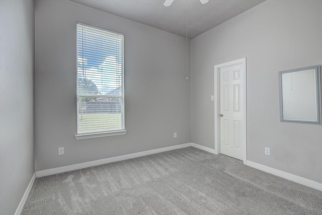 8014 Pine Wood Ct, Baytown, TX 77523 - carpeted empty room featuring baseboards and a ceiling fan