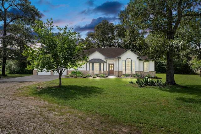 9119 Bush Buck Ln, Conroe, TX 77303 - view of front of property with concrete driveway and a front yard