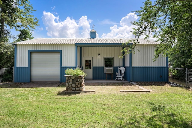 9119 Bush Buck Ln, Conroe, TX 77303 - rear view of house with a chimney, cooling unit, and a metal roof
