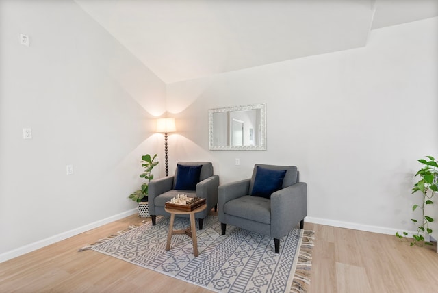9119 Bush Buck Ln, Conroe, TX 77303 - sitting room with wood finished floors and lofted ceiling