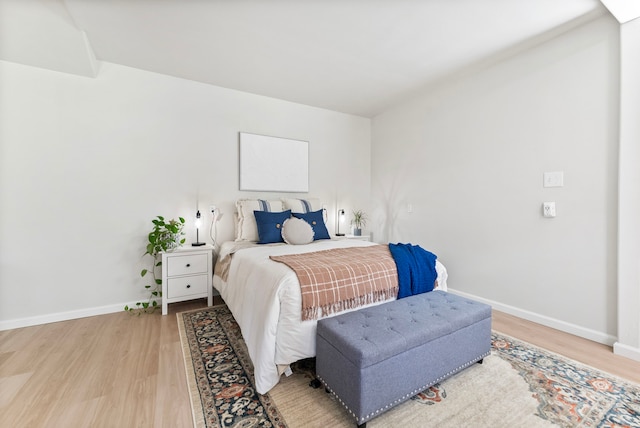 9119 Bush Buck Ln, Conroe, TX 77303 - bedroom featuring light wood-style floors and baseboards