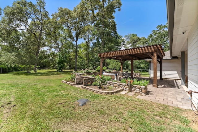 9119 Bush Buck Ln, Conroe, TX 77303 - view of green lawn featuring a pergola and a patio