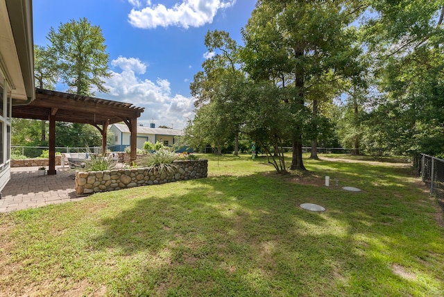 9119 Bush Buck Ln, Conroe, TX 77303 - view of yard featuring a pergola and a patio area