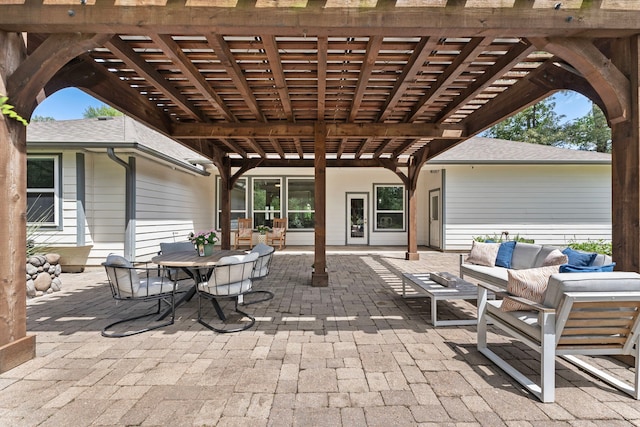 9119 Bush Buck Ln, Conroe, TX 77303 - view of patio / terrace featuring an outdoor living space, a pergola, and outdoor dining space