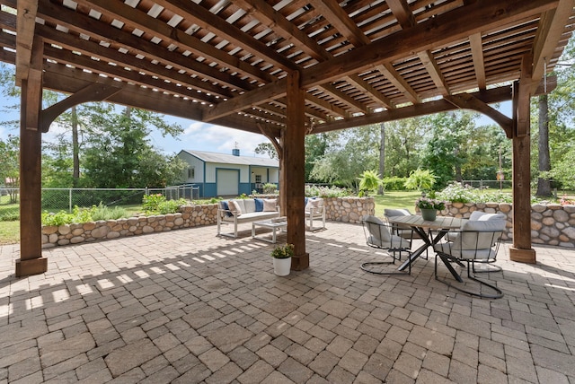 9119 Bush Buck Ln, Conroe, TX 77303 - view of patio / terrace featuring a pergola, outdoor dining space, and an outdoor structure