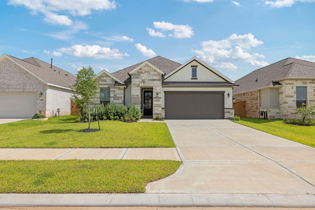3023 Tantara Dr, Katy, TX 77493 - view of front of home featuring stone siding, concrete driveway, a garage, a front lawn, and stucco siding