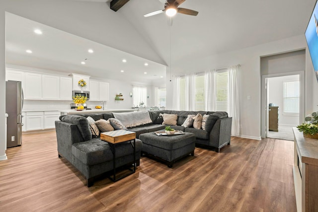 3023 Tantara Dr, Katy, TX 77493 - living room featuring recessed lighting, beam ceiling, wood finished floors, a ceiling fan, and high vaulted ceiling