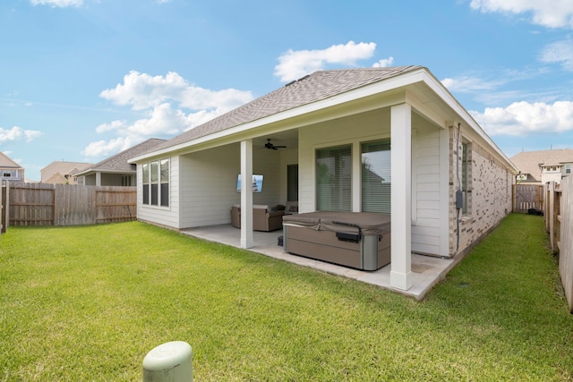 3023 Tantara Dr, Katy, TX 77493 - rear view of property featuring ceiling fan, a patio, a fenced backyard, a hot tub, and roof with shingles