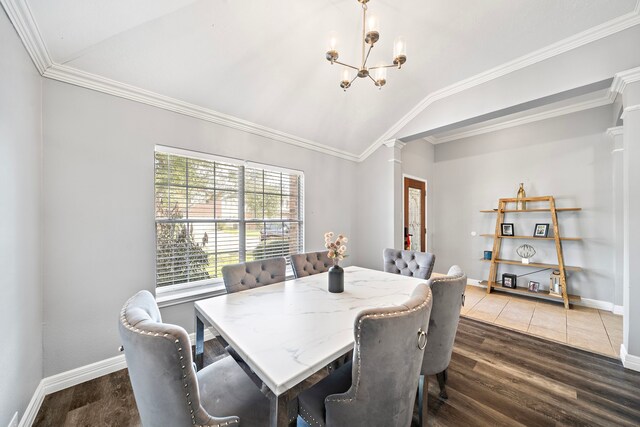 1727 Caldbeck Ln, Fresno, TX 77545 - dining space with ornate columns, lofted ceiling, wood finished floors, a chandelier, and ornamental molding