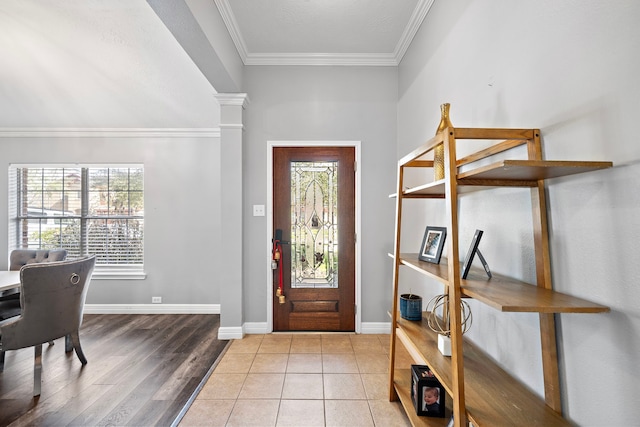 1727 Caldbeck Ln, Fresno, TX 77545 - entrance foyer with healthy amount of natural light, ornamental molding, ornate columns, and wood finished floors