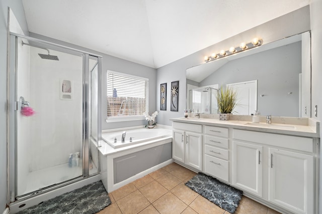 1727 Caldbeck Ln, Fresno, TX 77545 - bathroom featuring lofted ceiling, double vanity, a bath, a stall shower, and tile patterned floors