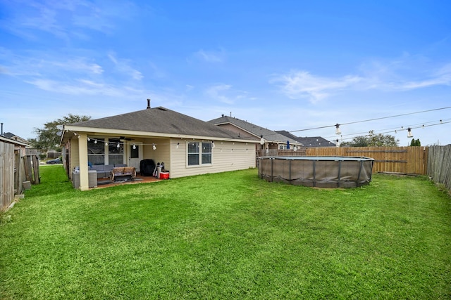 1727 Caldbeck Ln, Fresno, TX 77545 - rear view of house with ceiling fan, an outdoor living space, a fenced backyard, a patio area, and a shingled roof