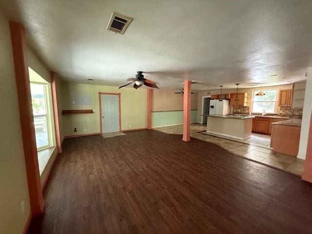 804 Tovrea Rd, Alvin, TX 77511 - unfurnished living room with wood finished floors and ceiling fan