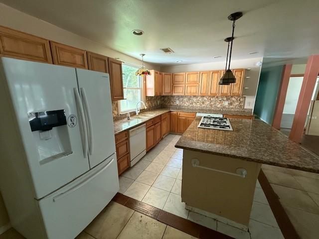 804 Tovrea Rd, Alvin, TX 77511 - kitchen with white appliances, tasteful backsplash, stone counters, light tile patterned floors, and recessed lighting
