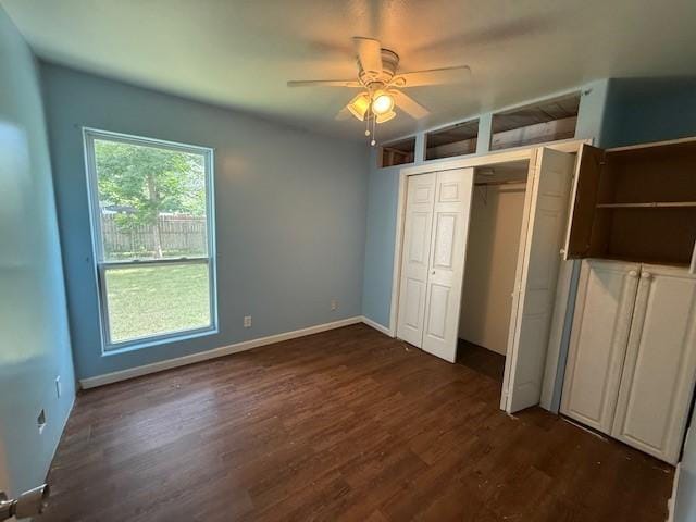 804 Tovrea Rd, Alvin, TX 77511 - unfurnished bedroom with dark wood-style flooring, a ceiling fan, and a closet
