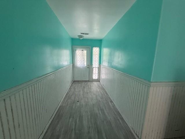 804 Tovrea Rd, Alvin, TX 77511 - corridor with wainscoting and wood finished floors