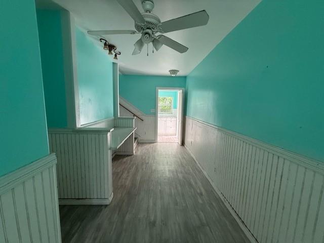 804 Tovrea Rd, Alvin, TX 77511 - hall featuring a wainscoted wall, stairway, and wood finished floors