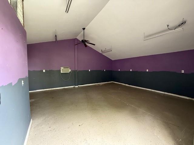 804 Tovrea Rd, Alvin, TX 77511 - garage featuring a ceiling fan and a wall unit AC