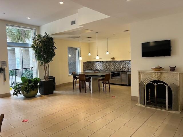 300 St Joseph Pkwy Unit 116, Houston, TX 77002 - dining area with recessed lighting and light tile patterned floors
