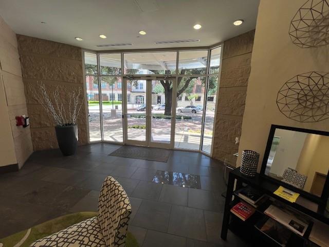 300 St Joseph Pkwy Unit 116, Houston, TX 77002 - community lobby featuring expansive windows and recessed lighting