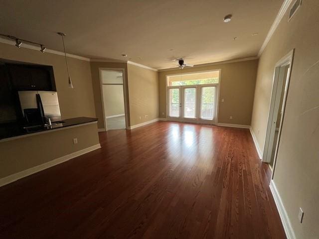 300 St Joseph Pkwy Unit 116, Houston, TX 77002 - unfurnished living room with crown molding, dark wood-type flooring, and a ceiling fan