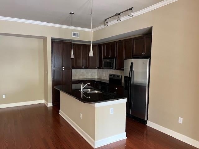 300 St Joseph Pkwy Unit 116, Houston, TX 77002 - kitchen with appliances with stainless steel finishes, dark countertops, tasteful backsplash, dark brown cabinets, and crown molding