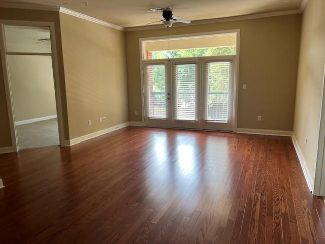 300 St Joseph Pkwy Unit 116, Houston, TX 77002 - empty room with a ceiling fan, wood finished floors, and ornamental molding