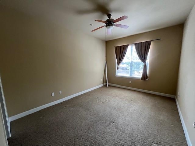 300 St Joseph Pkwy Unit 116, Houston, TX 77002 - empty room with ceiling fan and carpet