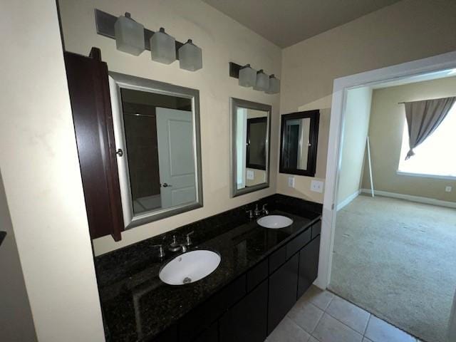 300 St Joseph Pkwy Unit 116, Houston, TX 77002 - full bath with double vanity and tile patterned flooring