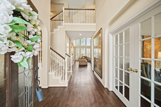 3207 Summerwind Ct, Pearland, TX 77584 - foyer entrance with french doors, stairway, a towering ceiling, and dark wood-style floors